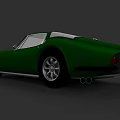 Green Two Door Vintage Sports Car With Streamlined Body And Silver Wheels