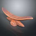 Handcrafted Wooden Sculpture With Intricate Carvings And Curved Design On Base