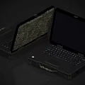 Two Rugged Camouflage Shell Laptops With Carry Handle And Open Display Design