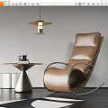 Brown Leather Lounge Chair With Metal Frame Side Table Coffee Cup And Book