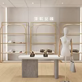 Modern Clothing Store Interior With Clothing Racks Mannequins Sofa And Green Plants