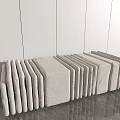 Light Gray Upholstered Sofa Benches Arranged In Row Against White Walls And Gray Floor