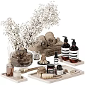 Elegant Daily Wash Essentials With Rolled Towels Soap Bottles Wooden Brush And White Flowers
