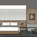 Modern Hotel Guest Room With Woven Wall Panel Large Bed Sofa Area And Coffee Table