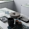 Stylish Decorative Ornaments Set With Black Mug Wooden Tray And Glass Cups On Marble Countertop