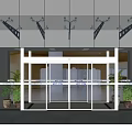 Modern Commercial Entrance With Glass Doors Facade Metal Brackets And Potted Plants
