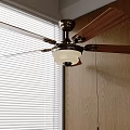 Modern Ceiling Fan Light with Wooden Blades and White Lampshade in Wooden Wall Interior
