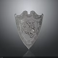 Silver Decorative Shield Featuring Ornate Carvings and Knight on Horseback Design