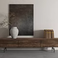 Brown Wooden TV Stand with White Vase Branches and Books Against Wall Painting