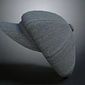 Gray Knitted Hat With Textured Surface And Curved Brim For Fashionable Look