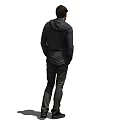 Man In Black Hoodie With Headphones Standing With Hands In Pockets Against White Background