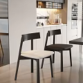 Modern Black Dining Chairs With White Cushions In Kitchen Dining Area