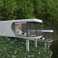 Modern White Lakeside Guesthouse Building Featuring Large Windows Terrace Surrounded By Trees And Stones