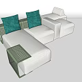 Modern White Sectional Sofa With Green Cushions And Black Grid Armrests