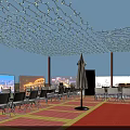 Vibrant Commercial Street With Decorative String Lights Folding Chairs And Outdoor Umbrellas Under Evening Sky