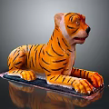 Decorative Lying Tiger Shaped Figure With Orange Black Striped Body On Base