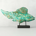 Turquoise Fish Shaped Decorative Ornament With Textured Design And Black Base Stand