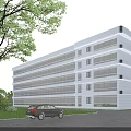 Modern Multi Storey Office Building With Large Glass Windows Surrounding Lawn And Parked Cars