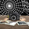 Vintage Canon Digital Camera On Wooden Table With Spider Web And 3d model