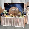 Delicious Dessert And Fruit Platter Display With Floral Decor Wooden Frames Brand Logo At Event