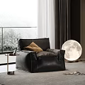 Black Leather Bean Bag Chair In Modern Living Room With Moon Shaped Lamp