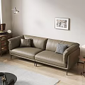Modern Two Seater Leather Sofa With Decorative Pillows And Wooden Side Table And Wall Art