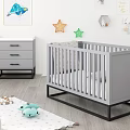 Gray Baby Crib with Black Frame in Nursery Room with Star Decorations and Gray Dresser