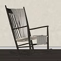 Black Rocking Chair With Light Blanket And Woven Seat In Minimalist Room
