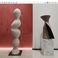 White Spiral And Brown Black Geometric Sculptures On Marble And Black Bases In Gallery