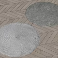 Two Round Rugs With Braided Texture On Herringbone Wood Floor 3d model