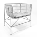 Stylish Wicker Leisure Chairs With Light Brown And Black Frames And Patterned Cushions