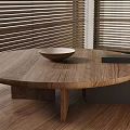 Wooden Round Table With Bowl In Interior Featuring Wooden Floor And Window Blinds