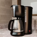 Black Coffee Maker with Glass Carafe and Automatic Brew Function on Kitchen Countertop 3d model