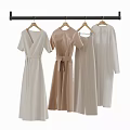 Elegant Neutral Colored Dresses Hanging On Wooden Rack Various Minimalist Designs