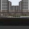 Modern High Rise Residential Community Entrance With Green Belt And Buildings