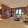 Hotel Guest Room Interior With Comfortable Sofa Coffee Table Wooden Paneling And Plaid Carpet