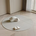 Minimalist Round Woven Rug With White Bear Decor And Open Book In Living Space
