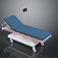 Medical Examination Bed With Blue Mattress White Frame And Digital Display On Wheels