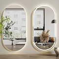 Two Oval LED Mirrors With Wall Mounted Design And Green Plant For Modern Interior