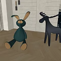 Green Rabbit And Black Deer Plush Stuffed Toys On Herringbone Wooden Floor