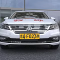 White Sedan Driving Instructor Training Car With Safety Logo And Coach Sign