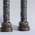 Three Ornate Columns With Intricate Carved Patterns White And Dark Colored Bases