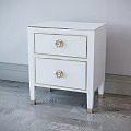 Elegant White Chest of Drawers with Gold Accents and Decorative Handles