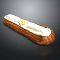 Fresh Cream Filled Eclair Pastry With White Icing And Golden Label