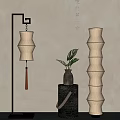 Elegant Traditional Floor Lamp With Layered Paper Shade In Interior Space With Green Plant And Vase