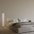 Modern Neutral Tones Double Bed With Spiral Floor Lamp And Soft Pillows On Beige Rug