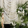 Elegant Wedding Decoration With White Drapes Hanging Ornaments Green Plants And Flowers