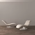 Modern Lounge Chairs With Sleek Design White Leather And Round Base On Wooden Floor