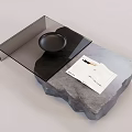 Modern Coffee Table With Rock Base Glass Top Black Tray And Open Book