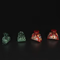 Four Small Pouches Featuring Two Green And Two Red Decorative Patterned On Black Background 3d model